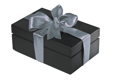 Norman Hege Jewelers | A black gift box wrapped with silver ribbon and a bow