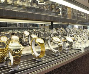 Norman Hege Jewelers | Glass display case showcasing a various selection of fine watches in gold and silver